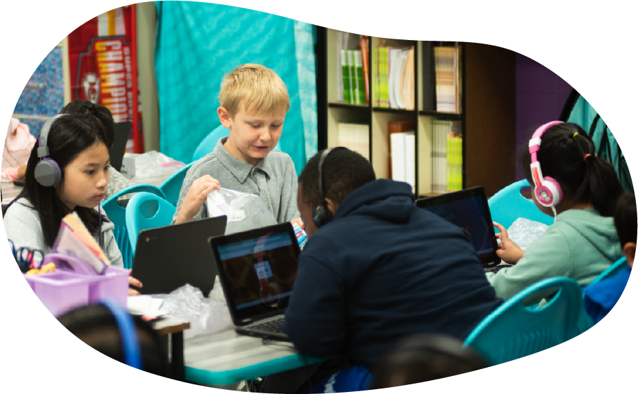 Students using laptops and tablets in an AI-supported classroom